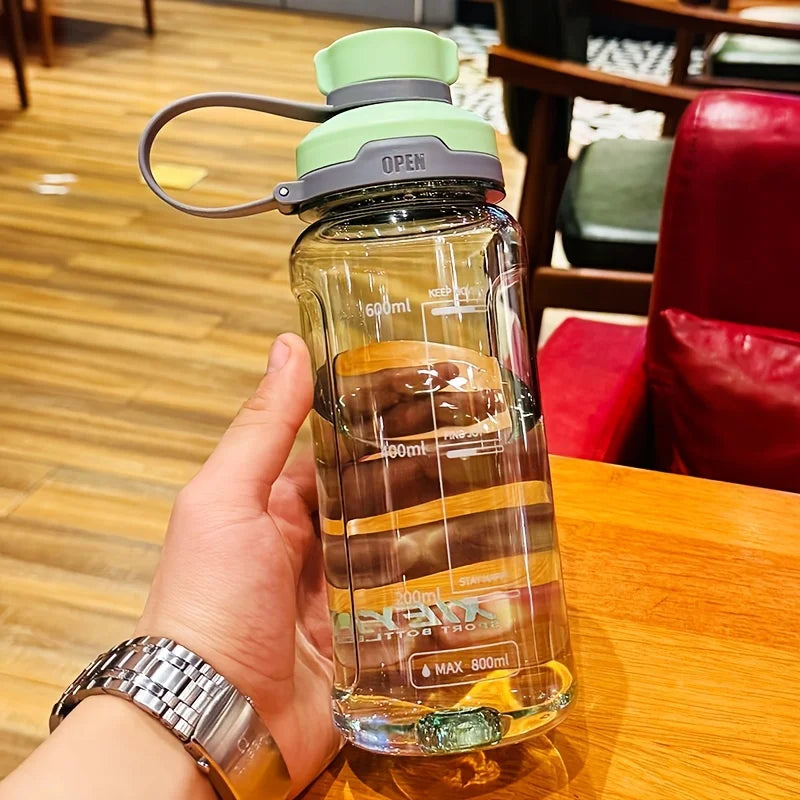 Large-capacity portable water bottle, made of high-transparency, drop-resistant PC material, with a leak-proof handle. Merch Eternally