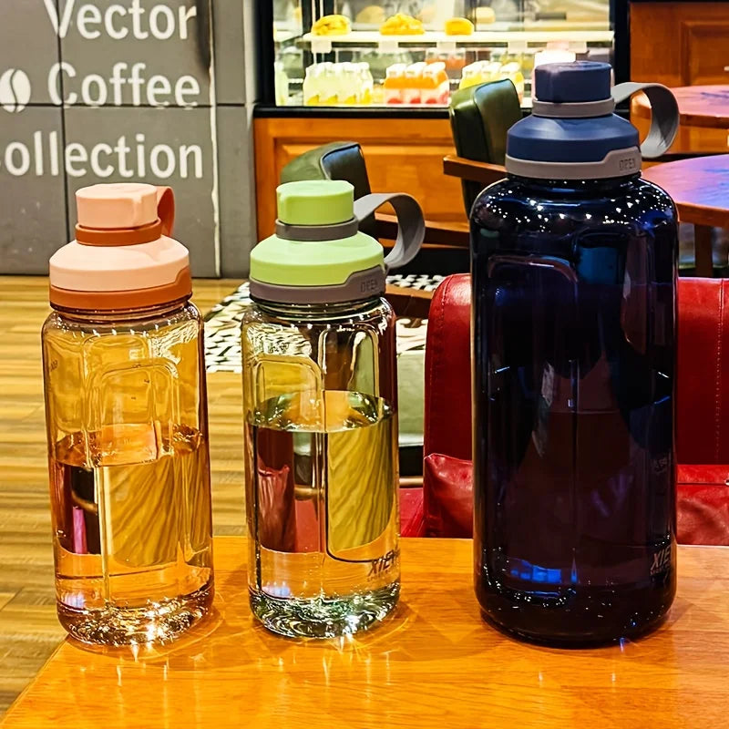 Large-capacity portable water bottle, made of high-transparency, drop-resistant PC material, with a leak-proof handle. Merch Eternally