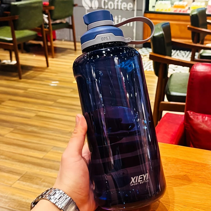 Large-capacity portable water bottle, made of high-transparency, drop-resistant PC material, with a leak-proof handle. Merch Eternally