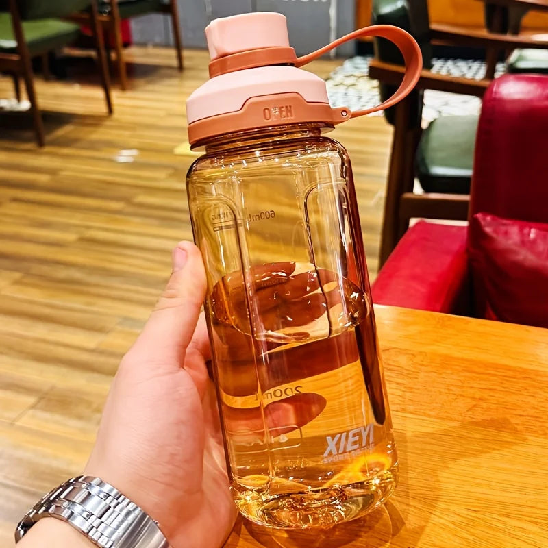 Large-capacity portable water bottle, made of high-transparency, drop-resistant PC material, with a leak-proof handle. Merch Eternally